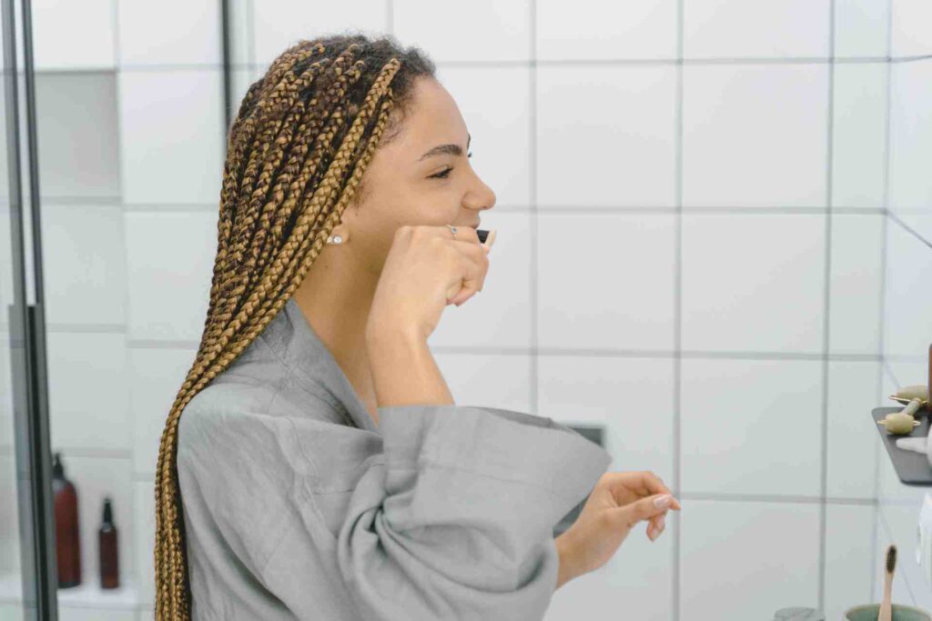Woman brushing her Teeth.