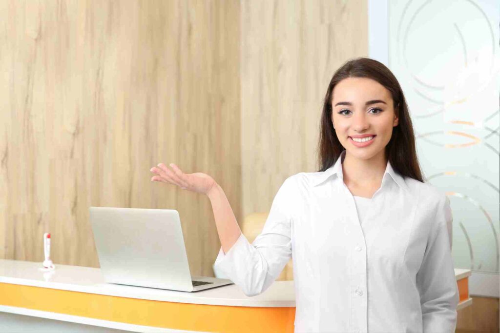 Young Female Receptionist by the Front Desk