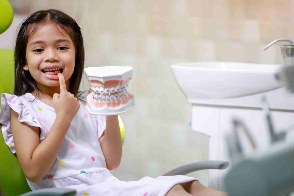 Cute girl is getting ready for her regular dental appointment at the dentist's office checkup.