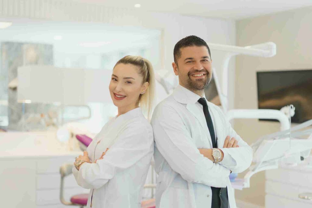 Male and female dentist at dentist office.
