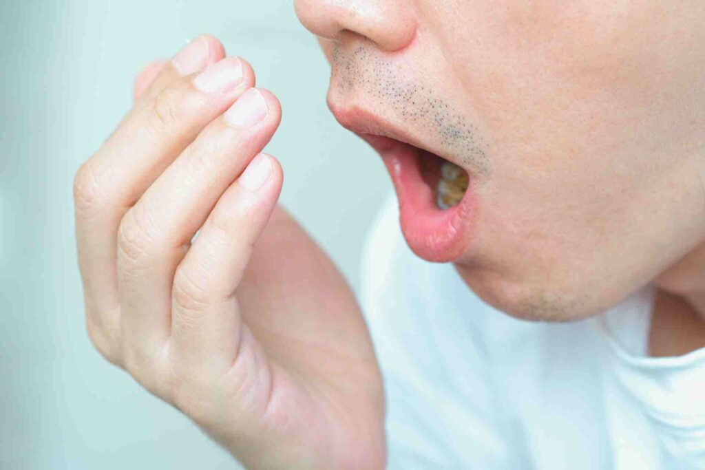 Man Checking for Bad Breath