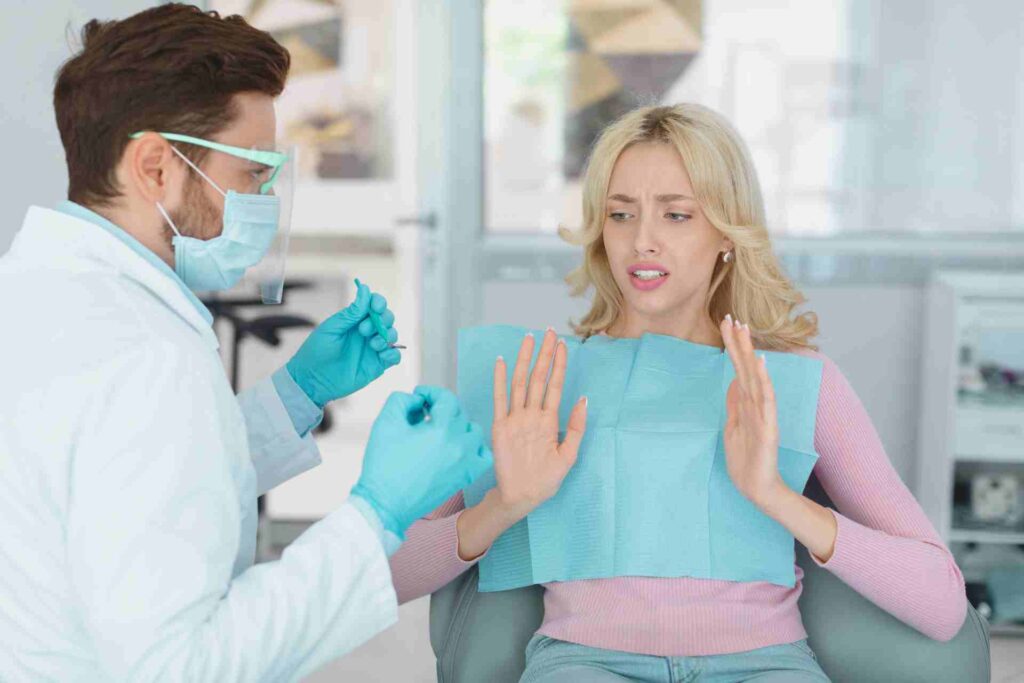 Female patient sufffering from dental phobia, avoid treatment