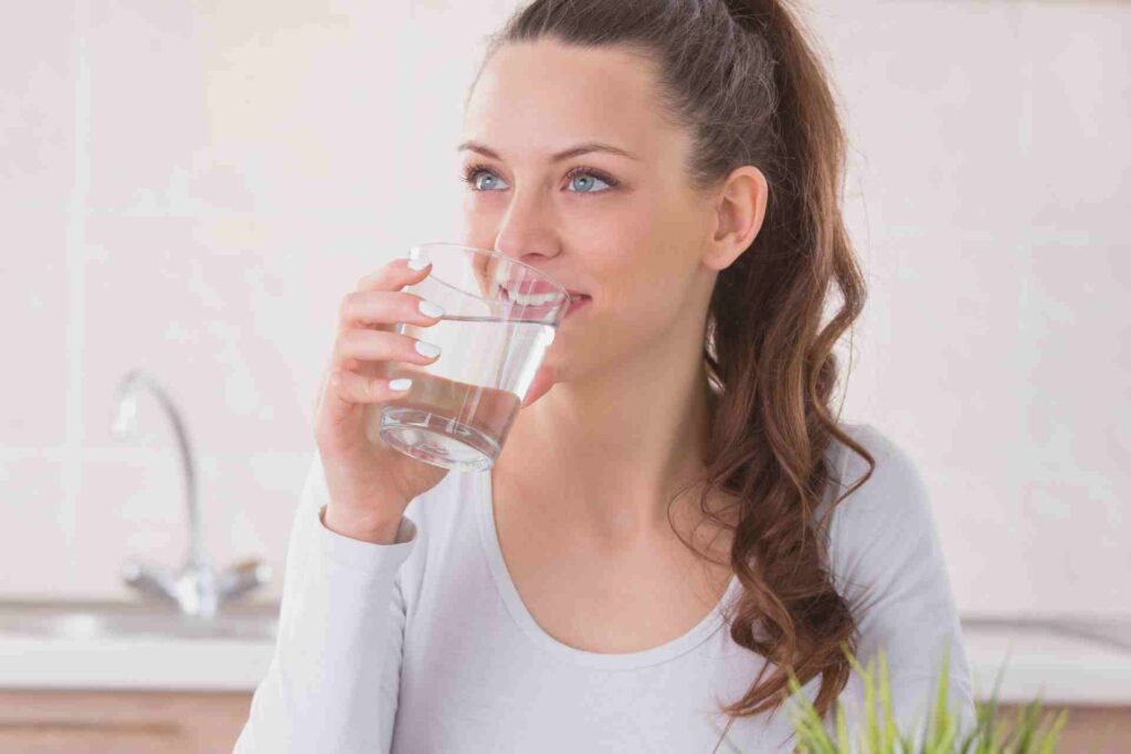 Woman drinking water.