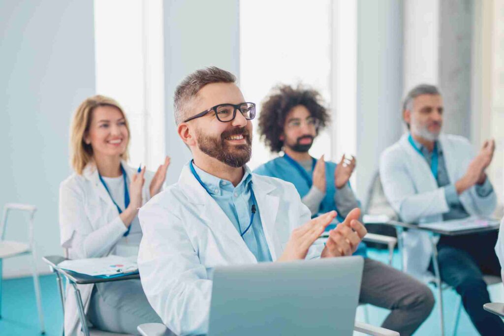 roup of Doctors Listening to Presentation on Medical Conference