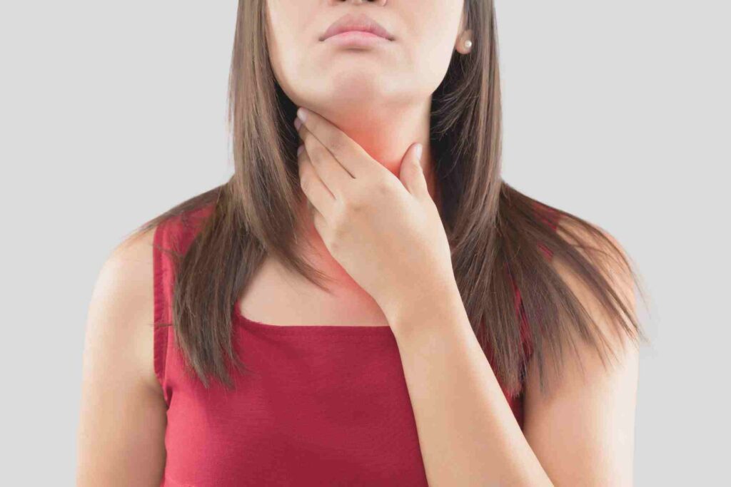 Woman with a sore throat.