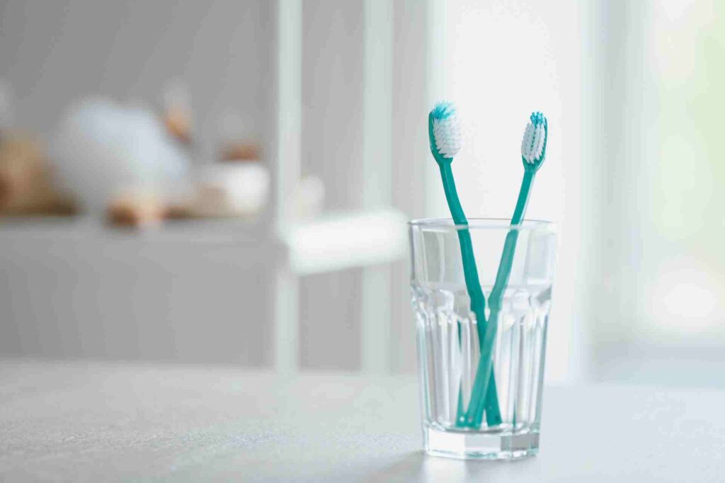 Toothbrushes on Table in Bathroom