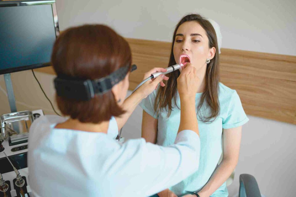 Doctor Checking Patient's Mouth