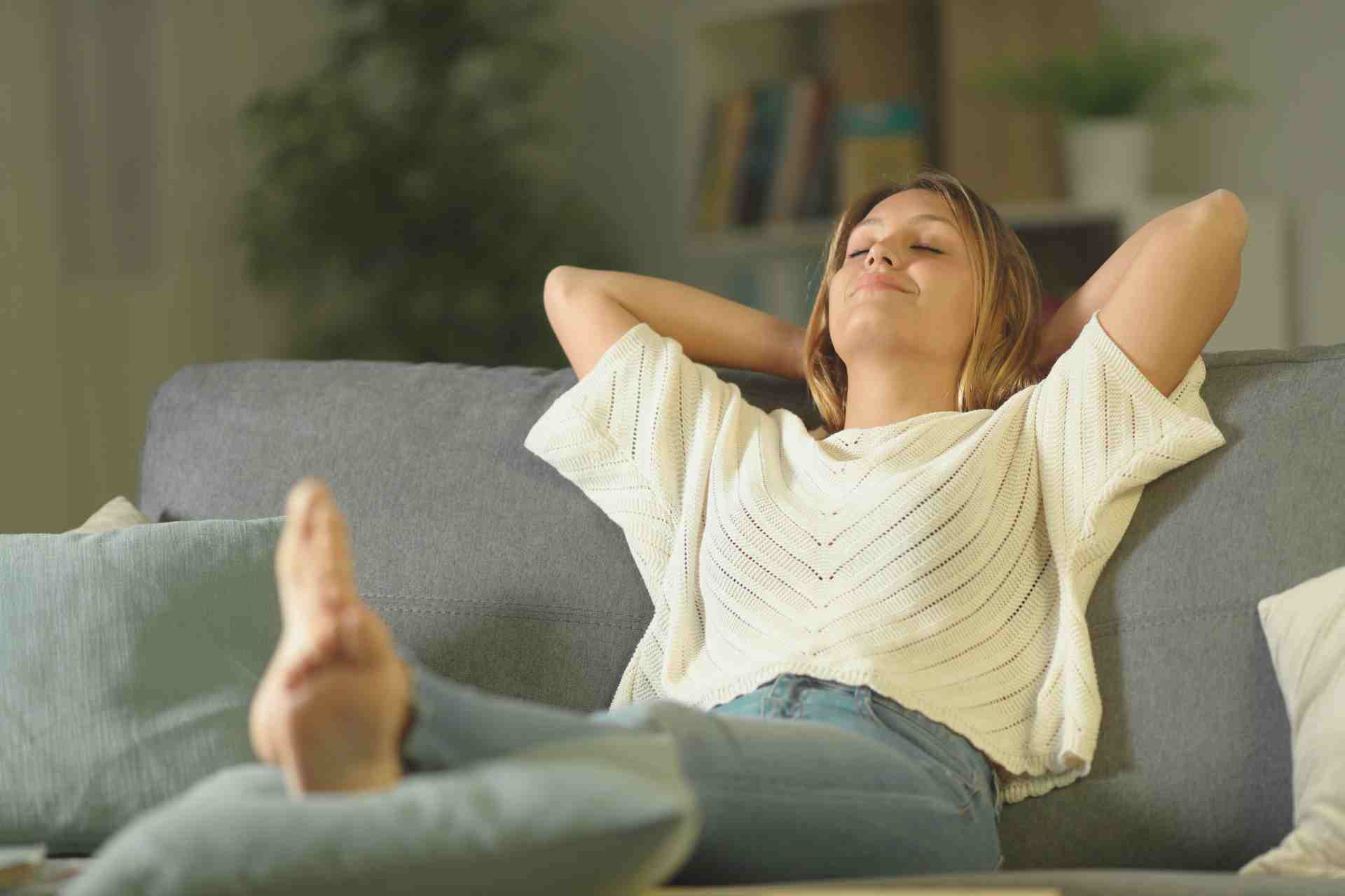 Woman resting on a couch.