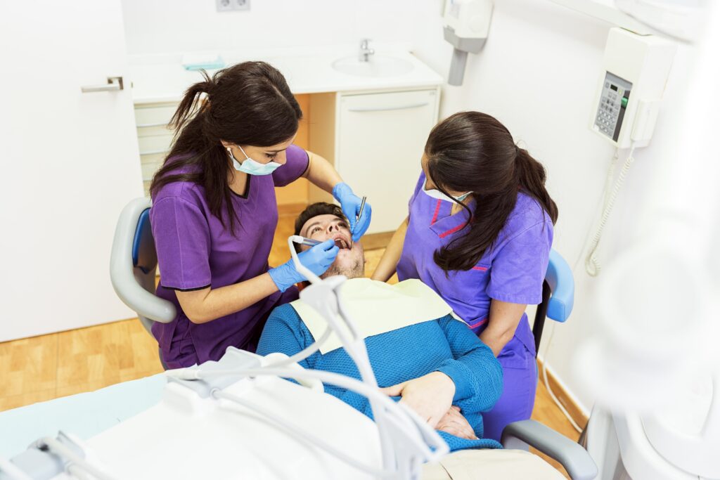 Dentists working in dental clinic